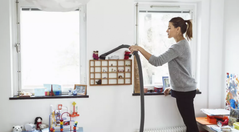 a women cleaning the room